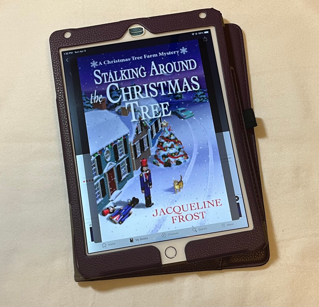 iPad showing cover of Stalking Around the Christmas Tree by Jacqueline Frost.