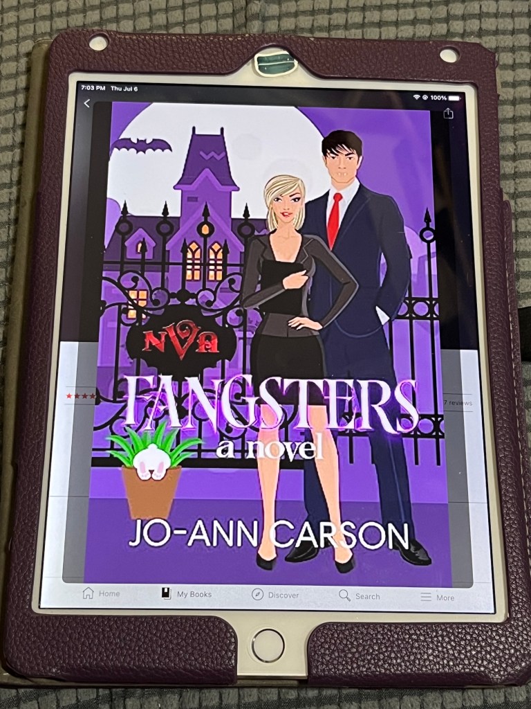 iPad showing cover of Fangsters: A Novel by Jo-Ann Carson
