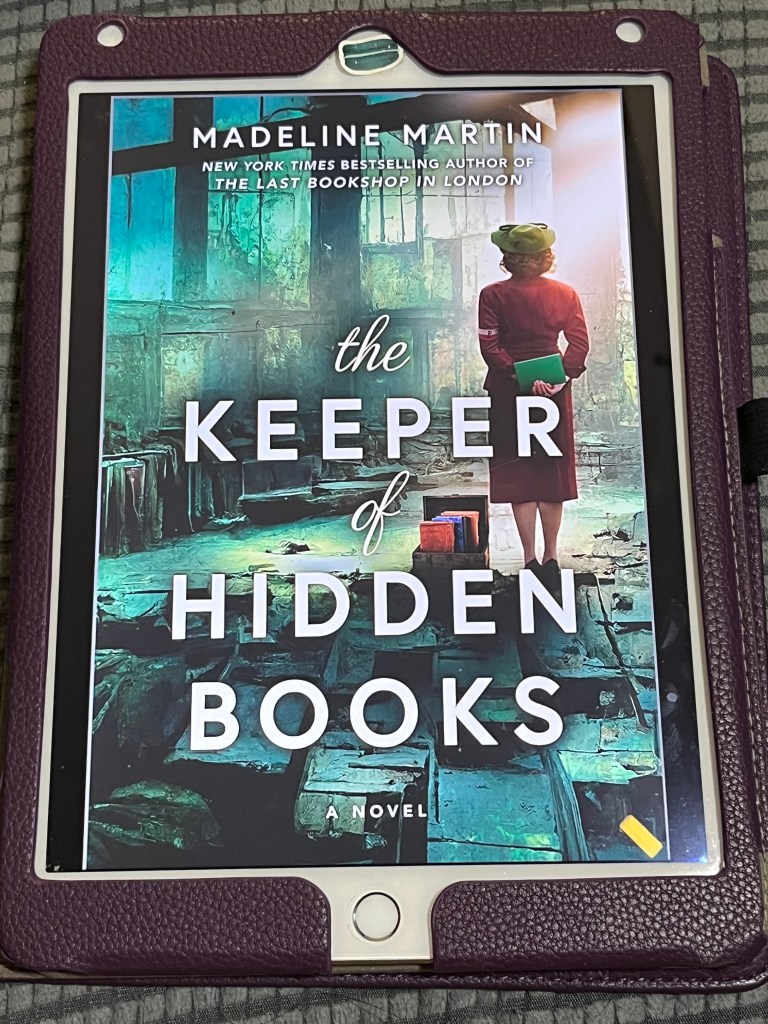 iPad showing the cover of The Keeper of Hidden Books by Madeline Martin.