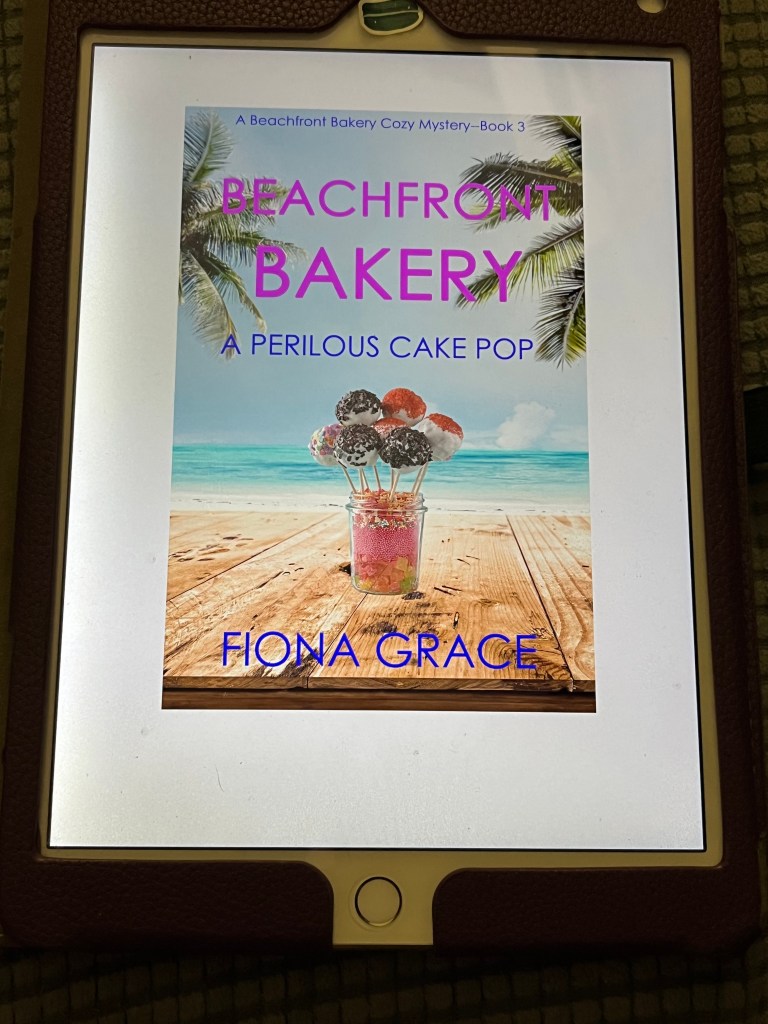 iPad showing the cover of A Perilous Cake Pop by Fiona Grace