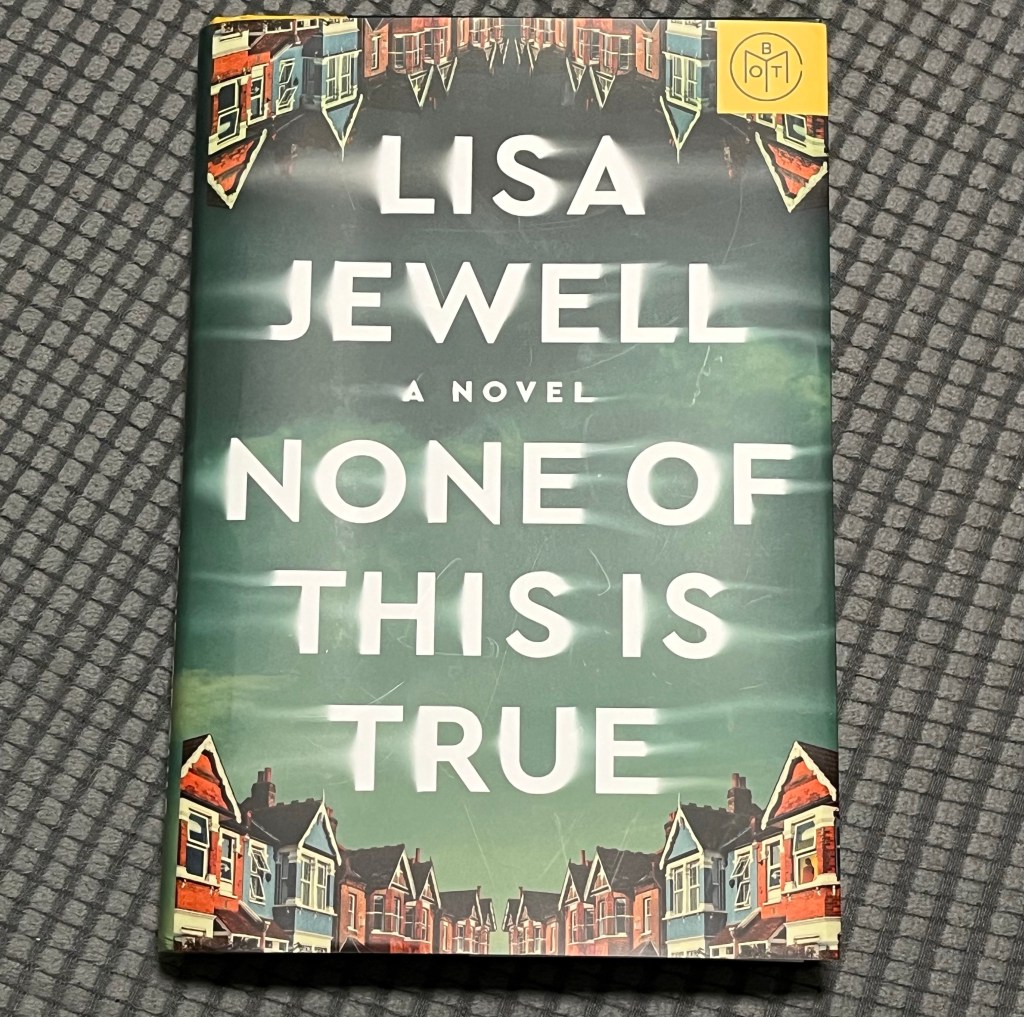 Photo of book None Of This Is True by Lisa Jewel on grey fabric background