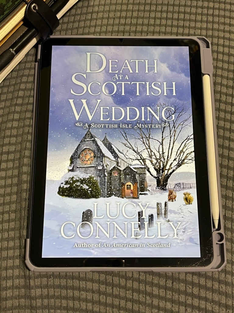 iPad Air showing cover of Death at a Scottish Wedding by Lucy Connelly