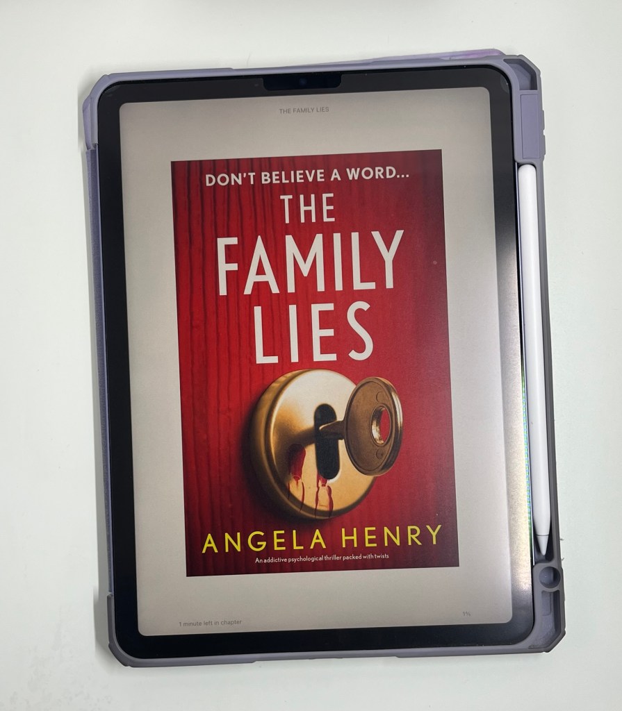 iPad showing the cover of The Family Lies by Angela Henry